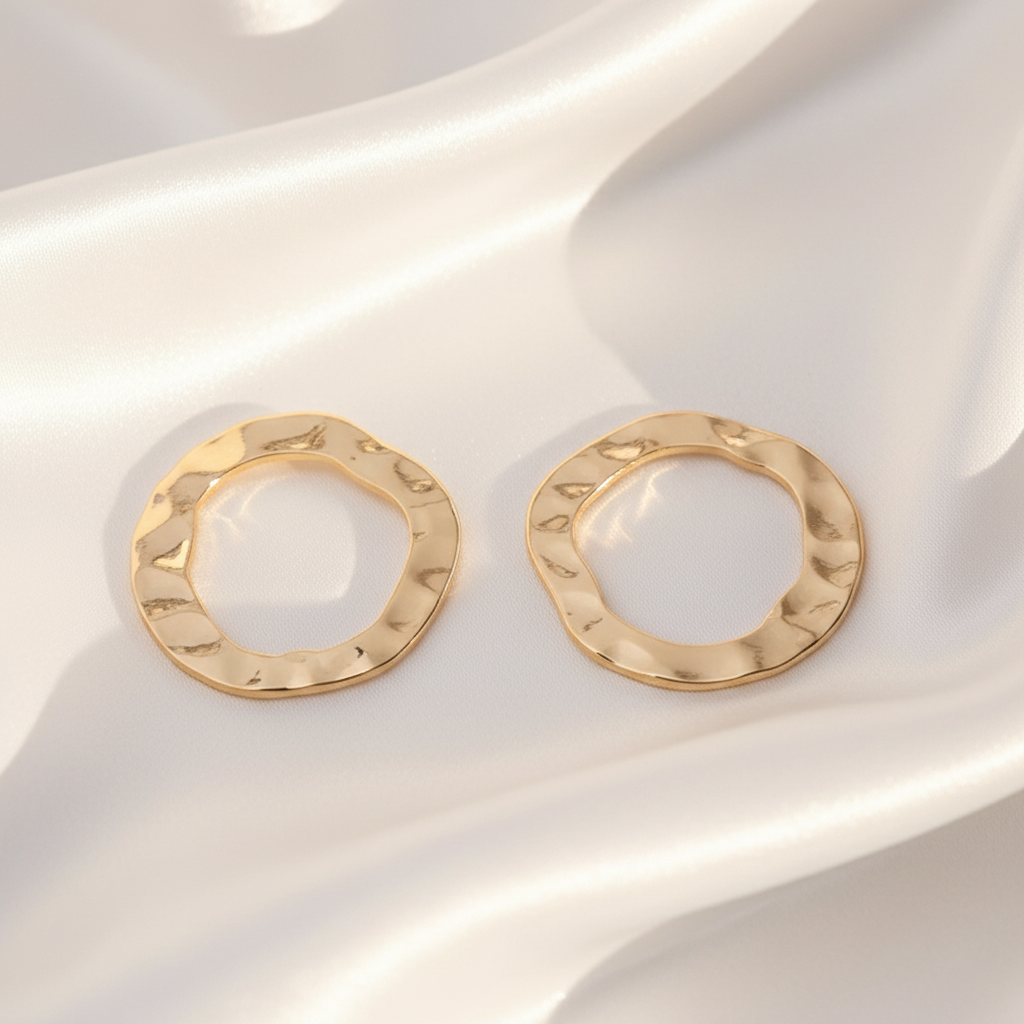 Ronde Golfvormige Oorbellen - Goud